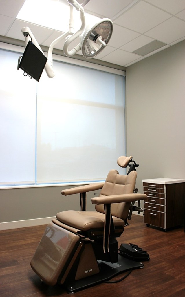 A patient room with a chair